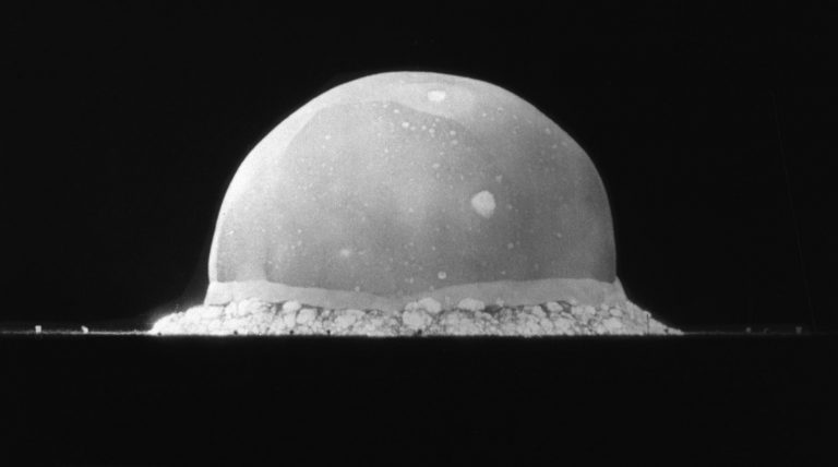 photo-of-the-earliest-instant-of-the-first-atomic-explosion-is-seen-as-a-grayish-white-semi-sphere-against-a-black-background