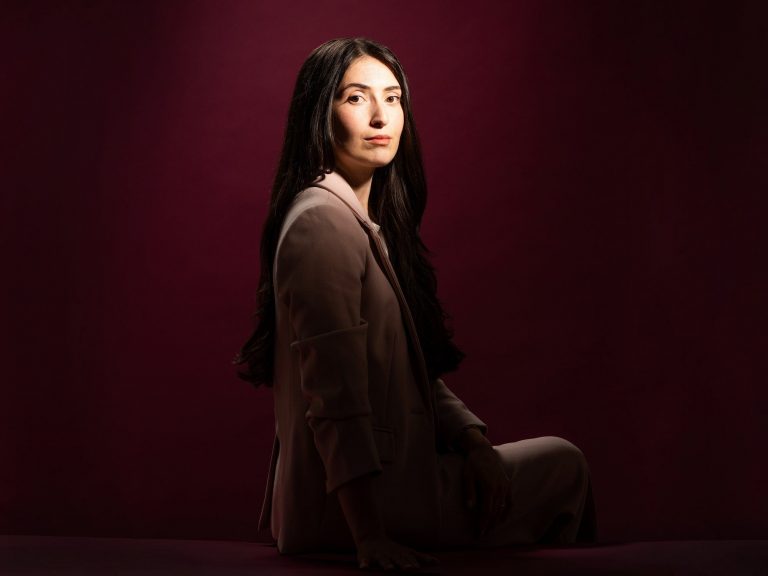 photo-of-woman-sitting-with-her-face-turned-toward-the-camera