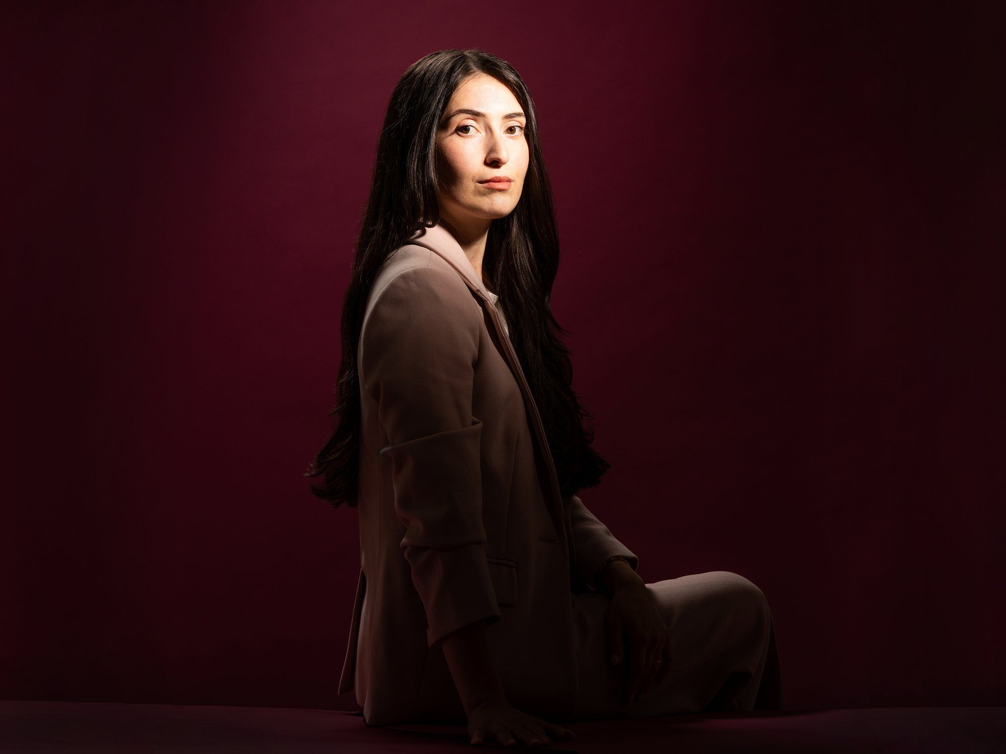 photo-of-woman-sitting-with-her-face-turned-toward-the-camera